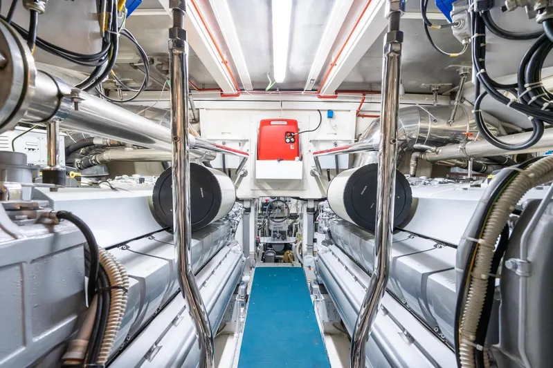 MilÙ II Yacht Photos Pics Engine room of 2009 Overmarine Mangusta 80 yacht, showcasing machinery and equipment.