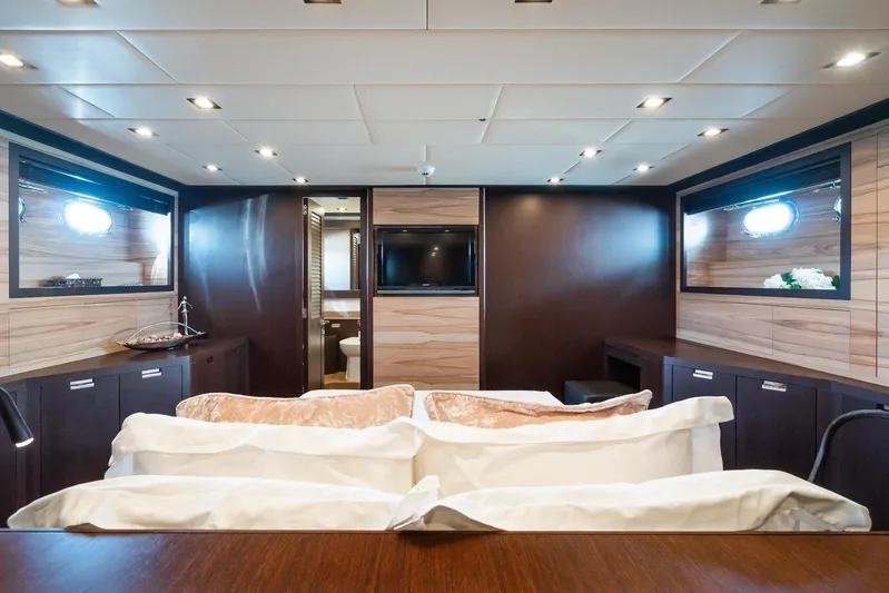 MilÙ II Yacht Photos Pics Luxurious interior of 2009 Overmarine Mangusta 80 yacht with elegant wood paneling.