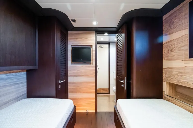 MilÙ II Yacht Photos Pics Luxurious interior of 2009 Overmarine Mangusta 80 yacht with twin beds and modern design.