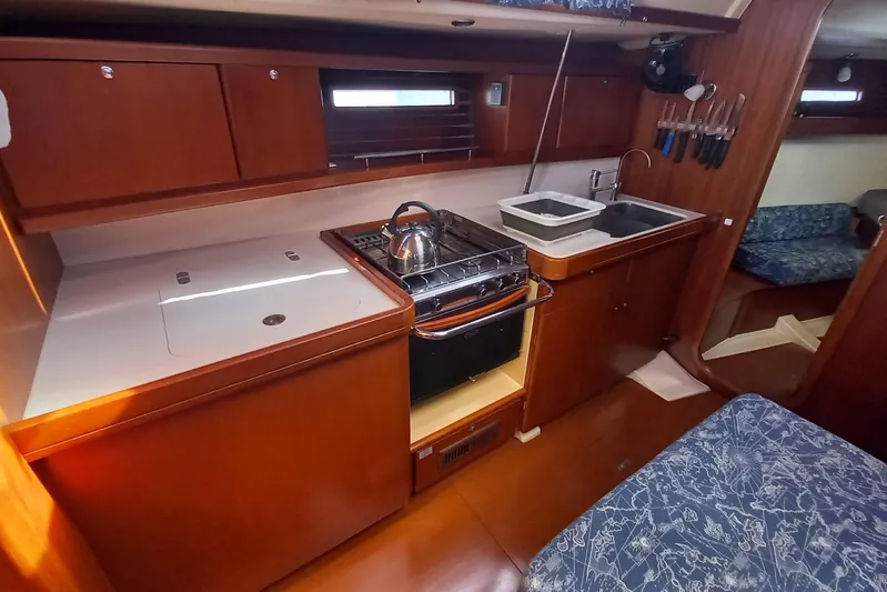We Reach Yacht Photos Pics Galley kitchen in 2011 Dufour 425 Grand Large yacht with stove and sink.