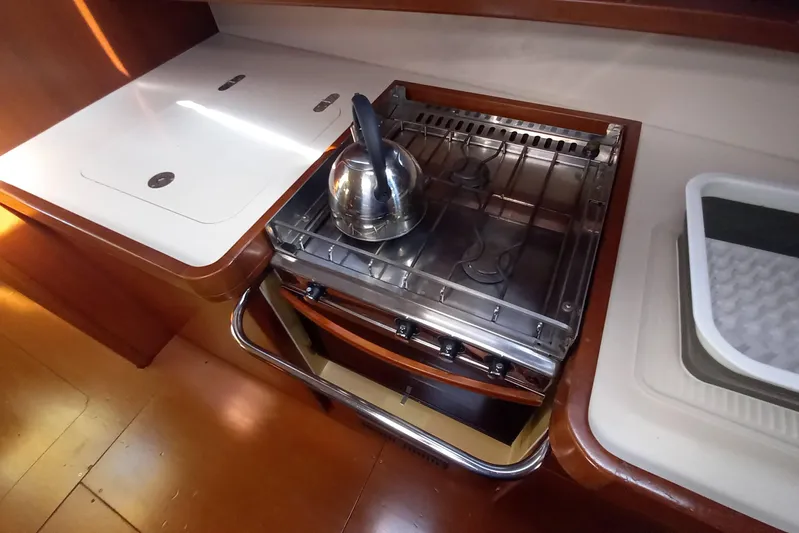 We Reach Yacht Photos Pics Galley kitchen in 2011 Dufour 425 Grand Large yacht with stove and kettle.