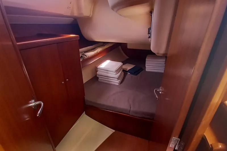 We Reach Yacht Photos Pics Cozy cabin interior of 2011 Dufour 425 Grand Large yacht with wooden finishes.