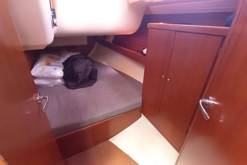 We Reach Yacht Photos Pics Cozy cabin interior of 2011 Dufour 425 Grand Large sailboat with wooden finish.