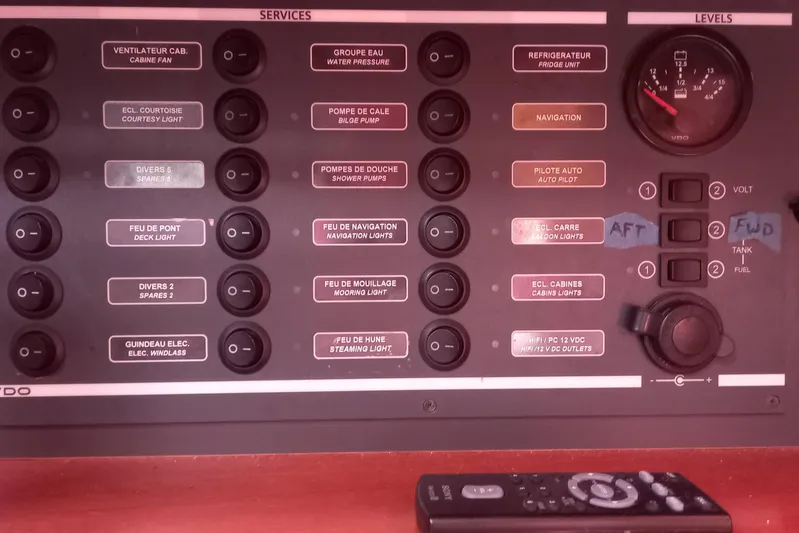 We Reach Yacht Photos Pics Control panel of a 2011 Dufour 425 Grand Large yacht with various switches and gauges.