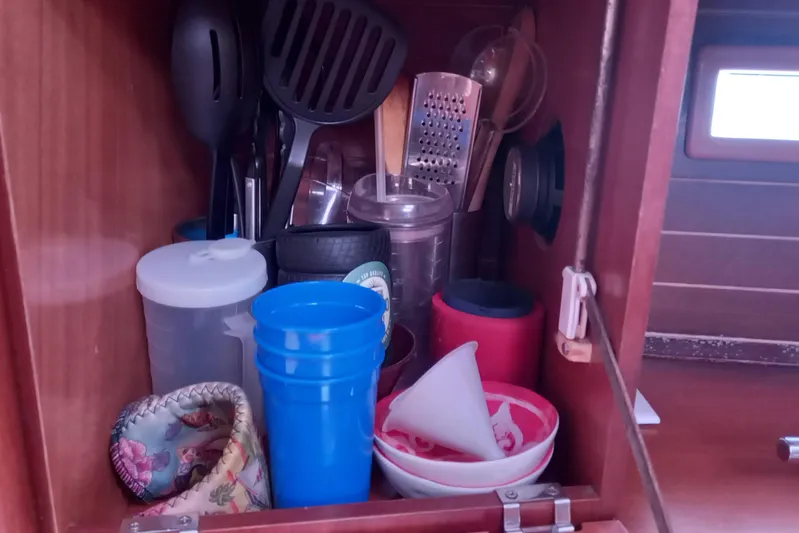 We Reach Yacht Photos Pics Cabinet with kitchen utensils and cups on a 2011 Dufour 425 Grand Large yacht.