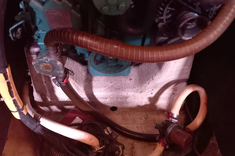 We Reach Yacht Photos Pics Engine compartment of a 2011 Dufour 425 Grand Large sailboat, showing hoses and components.