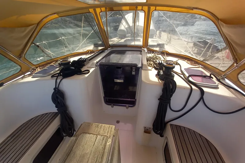 We Reach Yacht Photos Pics Cockpit of 2011 Dufour 425 Grand Large sailboat with ropes and seating.