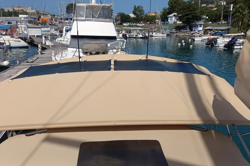 We Reach Yacht Photos Pics Dufour 425 Grand Large 2011 yacht docked at marina with beige canopy.