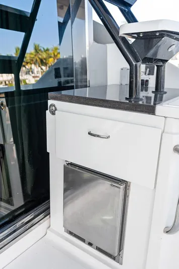 Guilty Pleasure Yacht Photos Pics 2014 Sea Ray 510 Fly yacht kitchenette with stainless steel appliances and sleek design.