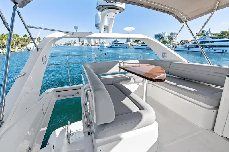 Guilty Pleasure Yacht Photos Pics 2014 Sea Ray 510 Fly yacht with spacious seating and scenic waterfront view.