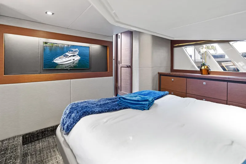 Guilty Pleasure Yacht Photos Pics Luxurious bedroom interior of 2014 Sea Ray 510 Fly yacht with modern decor.