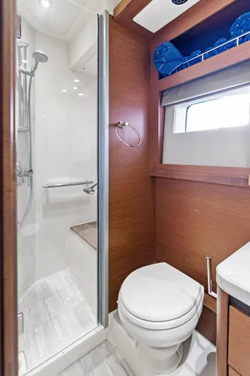 Guilty Pleasure Yacht Photos Pics 2014 Sea Ray 510 Fly yacht bathroom with shower, toilet, and wooden accents.