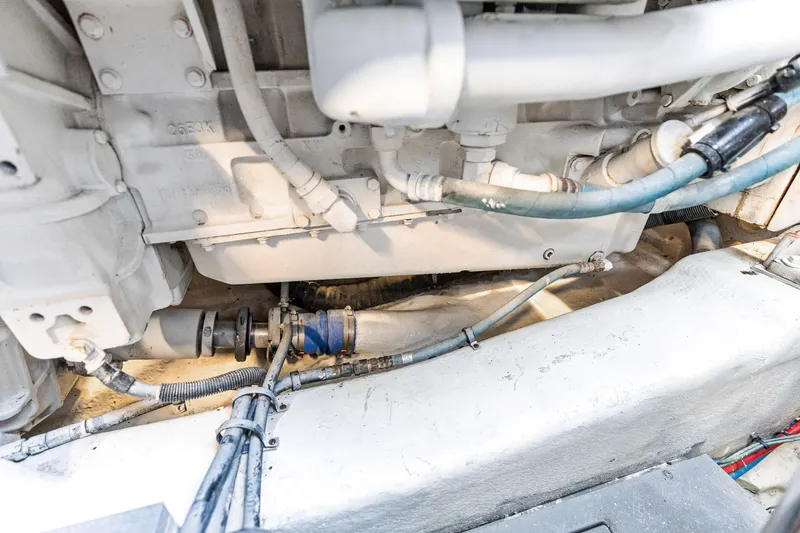 Guilty Pleasure Yacht Photos Pics Engine compartment of 2014 Sea Ray 510 Fly, showcasing mechanical components and hoses.