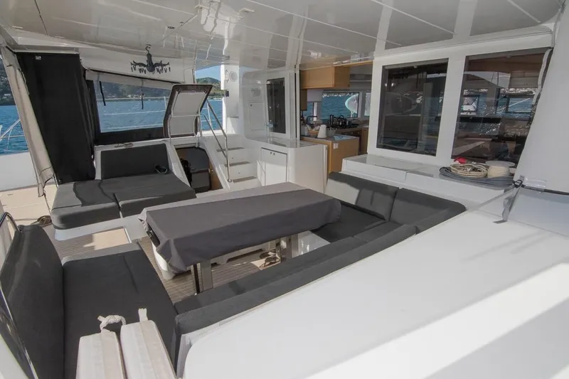 Oui Cherie Yacht Photos Pics Spacious interior of 2017 Lagoon 52 F catamaran with modern seating and dining area.