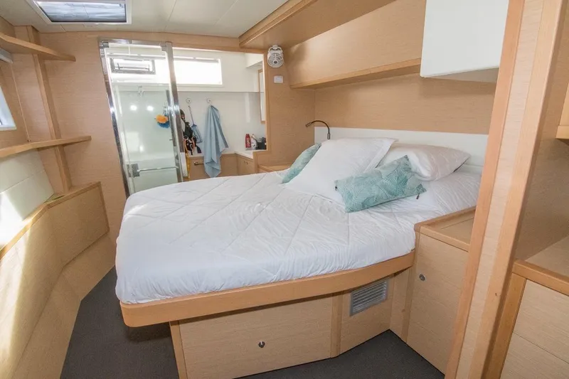 Oui Cherie Yacht Photos Pics Luxurious cabin interior of 2017 Lagoon 52 F yacht with cozy bed and modern design.