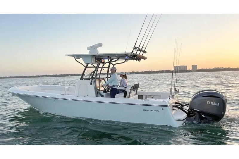  Yacht Photos Pics Manufacturer Provided Image: 2025 Sea Born LX26 Center Console boat cruising on water at sunset.