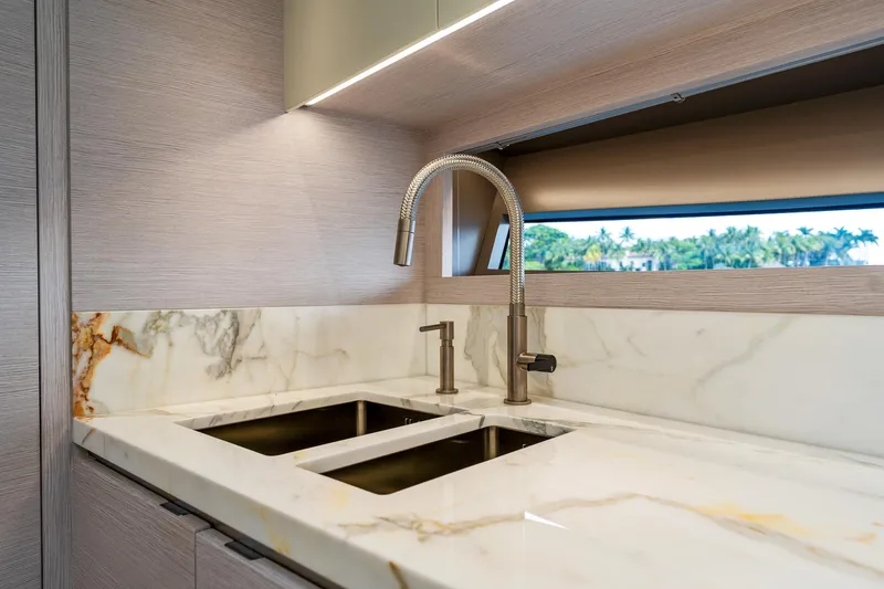  Yacht Photos Pics Luxurious marble sink in 2024 Uniesse Exuma HTC5p yacht kitchen.