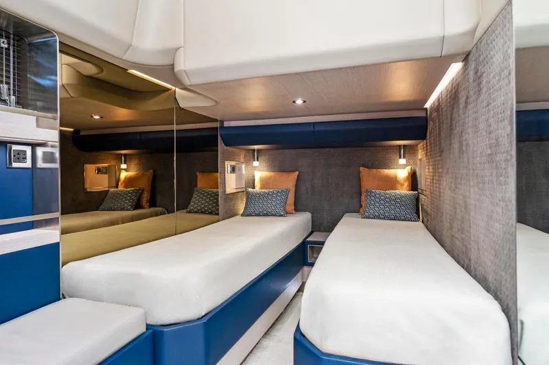  Yacht Photos Pics 2024 Uniesse Exuma HTC5p yacht interior with twin beds and modern design.