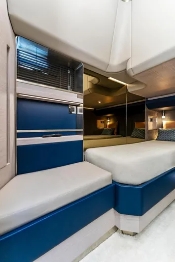 Yacht Photos Pics 2024 Uniesse Exuma HTC5p yacht interior with modern blue and beige design.