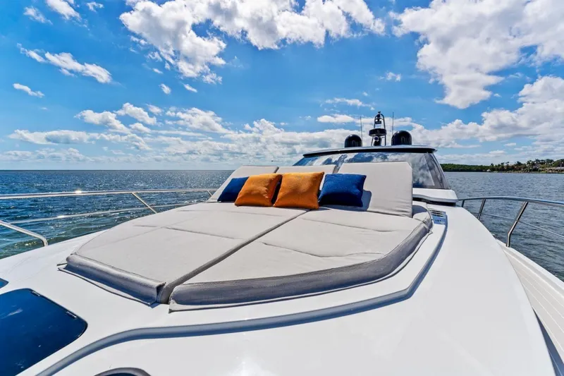  Yacht Photos Pics 2024 Uniesse Exuma HTC5p yacht with sunbathing deck, cushions, and ocean view.