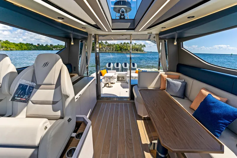  Yacht Photos Pics Luxurious interior of 2024 Uniesse Exuma HTC5p yacht with ocean view.