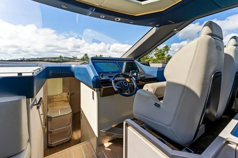  Yacht Photos Pics 2024 Uniesse Exuma HTC5p yacht interior with modern helm and luxurious seating.