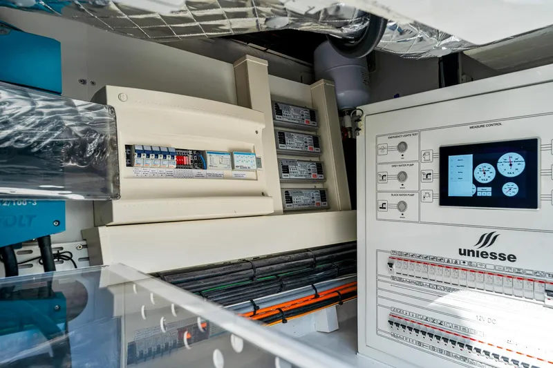  Yacht Photos Pics Electrical control panel of 2024 Uniesse Exuma HTC5p yacht, showcasing advanced systems and wiring.