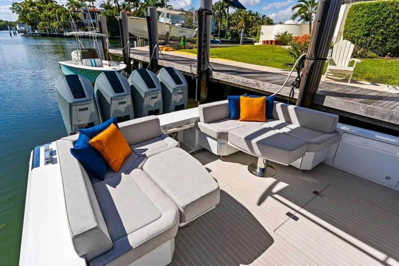  Yacht Photos Pics Luxurious 2024 Uniesse Exuma HTC5p yacht deck with plush seating and vibrant cushions.