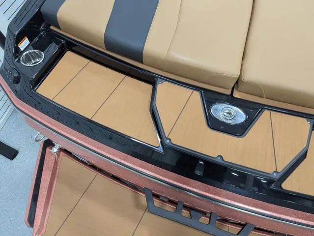 2025 Axis Wake Research A225 boat interior with tan and black seating.
