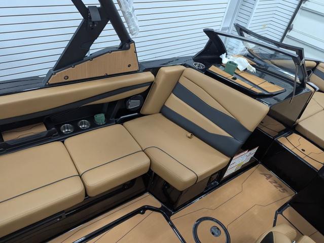2025 Axis Wake Research A225 boat interior with tan and black seating.