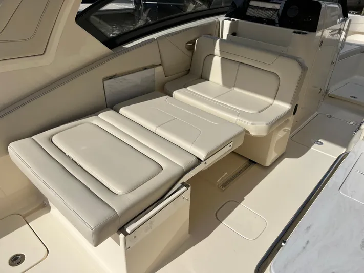  Yacht Photos Pics 2025 Scout 277 Dorado boat interior with adjustable seating and sleek design.