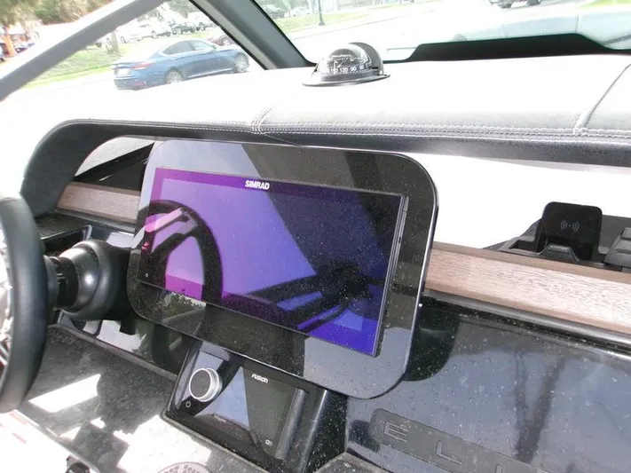  Yacht Photos Pics Dashboard of 2025 Monterey Elite 27 OB with Simrad display and steering wheel.