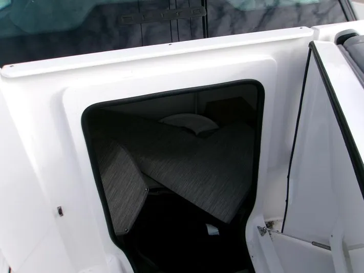  Yacht Photos Pics 2025 Monterey Elite 27 OB cabin interior with seating area.