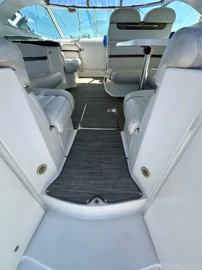  Yacht Photos Pics 2005 Doral Boca Grande boat interior with white seating and carpeted floor.