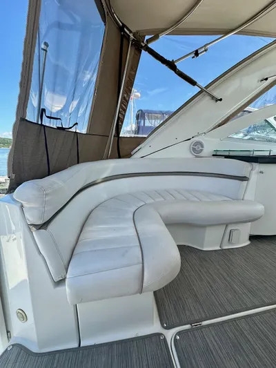  Yacht Photos Pics 2005 Doral Boca Grande boat interior with white leather seating and canopy.