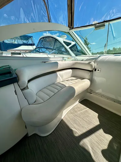 Yacht Photos Pics 2005 Doral Boca Grande boat interior with white seating and clear canopy.