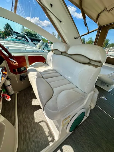  Yacht Photos Pics 2005 Doral Boca Grande boat interior with white seating and wood accents.