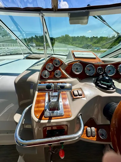  Yacht Photos Pics 2005 Doral Boca Grande boat dashboard with gauges and controls, under clear blue sky.