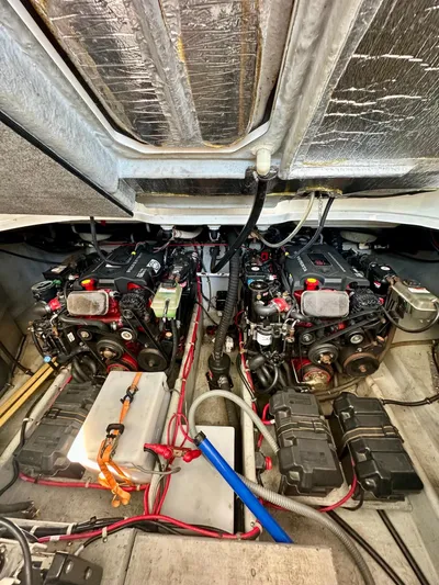  Yacht Photos Pics Engine room of a 2005 Doral Boca Grande boat, featuring dual engines and wiring.