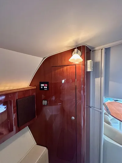  Yacht Photos Pics Interior of 2005 Doral Boca Grande boat with wood paneling and ambient lighting.