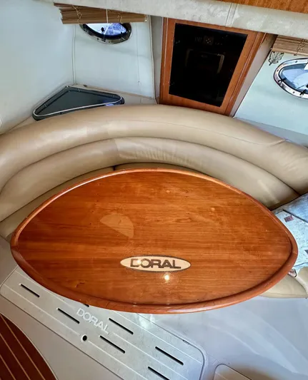  Yacht Photos Pics 2005 Doral Boca Grande interior with wooden table and beige seating.