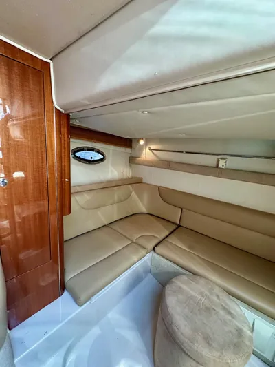  Yacht Photos Pics 2005 Doral Boca Grande boat interior with beige seating and wooden accents.