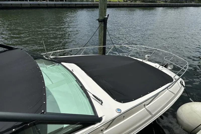  Yacht Photos Pics 2023 Sea Ray 320 DA-OB boat docked with black cover, waterfront view.