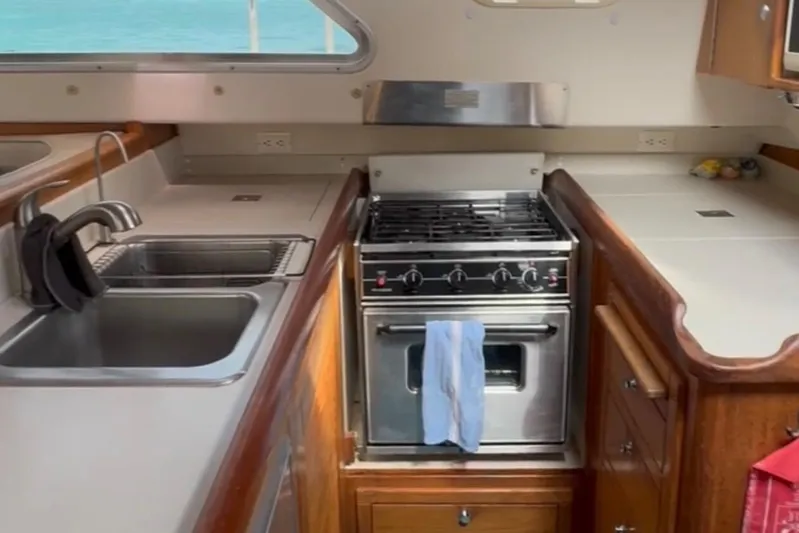 Tortuga Yacht Photos Pics Catalina Morgan 440 yacht kitchen interior with stove and sink, 2005 model.