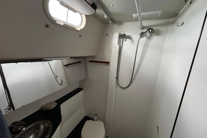Tortuga Yacht Photos Pics Compact bathroom in a 2005 Catalina Morgan 440 yacht, featuring shower and toilet.
