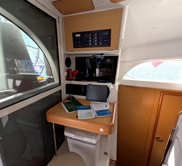 Kelapa Yacht Photos Pics Interior of 2016 Lagoon 380 S2 yacht with navigation station and control panel.