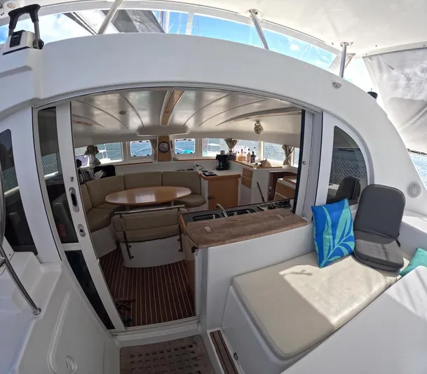 Kelapa Yacht Photos Pics Interior of 2016 Lagoon 380 S2 catamaran with seating and dining area.