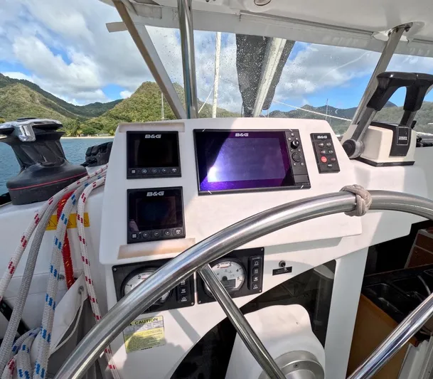 Kelapa Yacht Photos Pics Steering wheel and navigation instruments on a 2016 Lagoon 380 S2 catamaran.