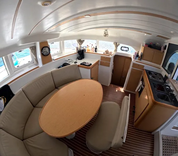 Kelapa Yacht Photos Pics Interior of 2016 Lagoon 380 S2 catamaran with cozy seating and modern kitchen.