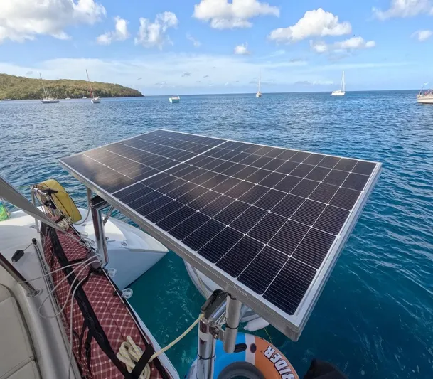 Kelapa Yacht Photos Pics Solar panel on Lagoon 380 S2 catamaran, 2016 model, anchored in scenic ocean bay.